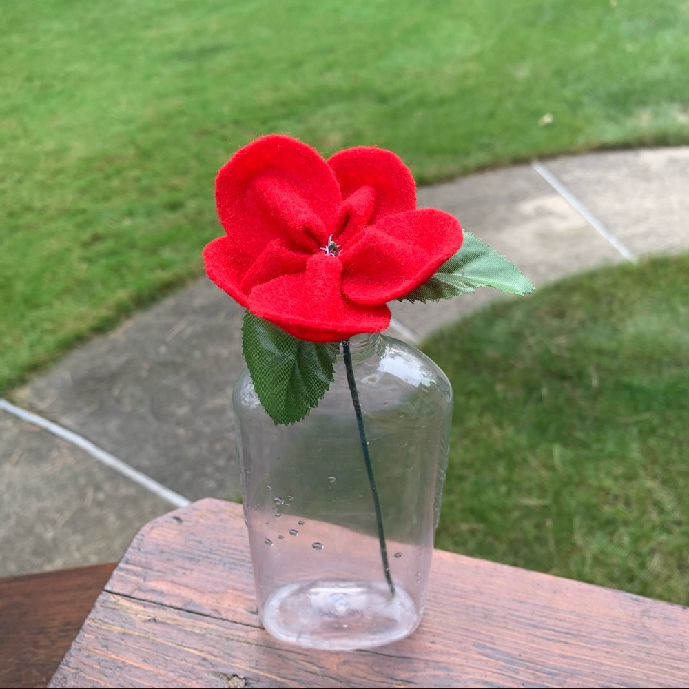 Red Felt Flower and Clear Plastic Vase